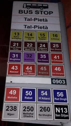 a bus stop sign for a bus stop taking prices at Giorgia House in Pieta