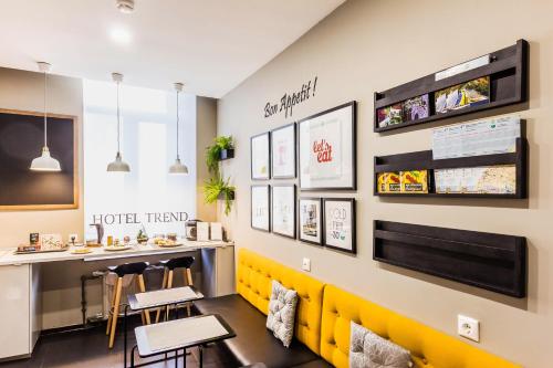 a restaurant with yellow chairs and a counter at Trend Samara in Samara