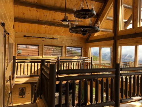 a view from the inside of a cabin with windows at A View from the Top in Sevierville