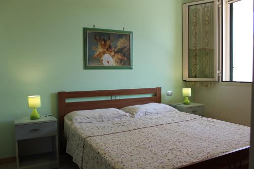Postel nebo postele na pokoji v ubytování Residence Jonico