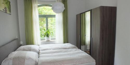Säng eller sängar i ett rum på Ferienwohnung in der Altstadt von Erfurt