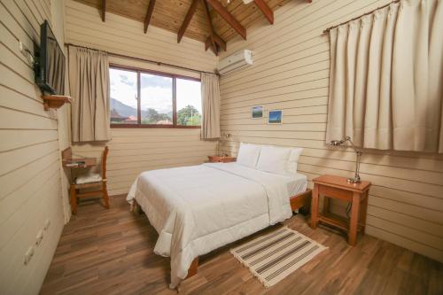 Postel nebo postele na pokoji v ubytování Carmen Hotel & Villas