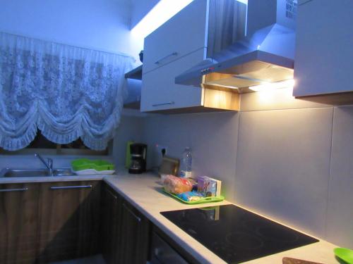 a kitchen with a sink and a counter top at Central Studio Apartment in Santa Venera