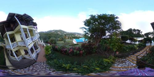 arial view of a building and a garden at Heavenly Suites in La Feuillet