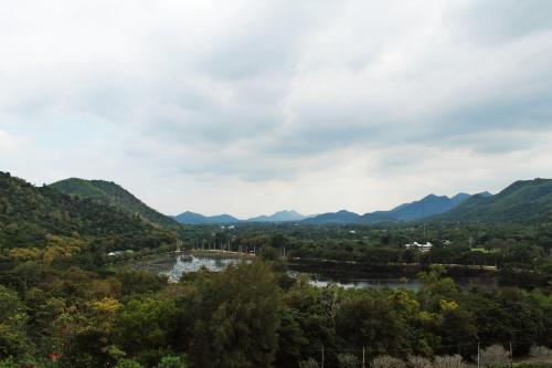 a view of the mountains and a river at Kaengkachan Lake Hill in Kaeng Krachan