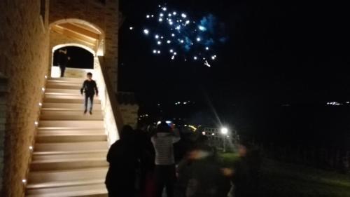 a group of people walking down stairs at night at B&B CasalFarano in Cupra Marittima