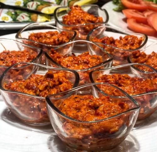 a group of glass bowls filled with food on a table at AEN Hotel-Old City in Skopje