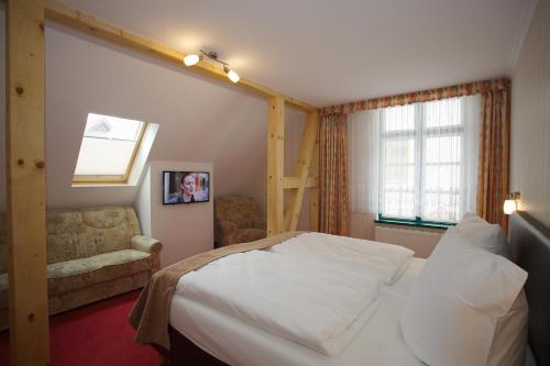 Ένα ή περισσότερα κρεβάτια σε δωμάτιο στο Hotel Doberaner Hof