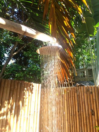 a stream of water is coming out of a fence at Bugoy Bikers Hostel in Cebu City