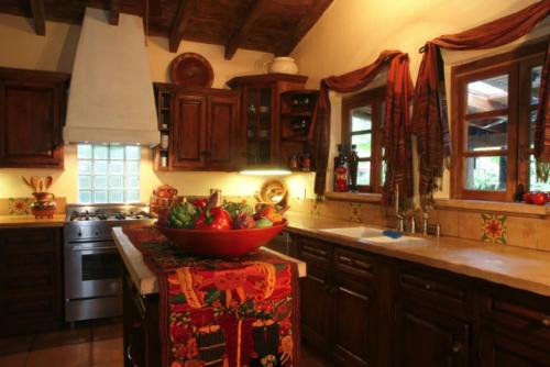 a kitchen with a bowl of fruit on the counter at Villa Thornhill in Palm Springs