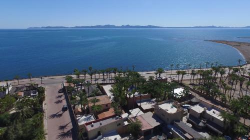 an aerial view of the beach and the ocean at Sukasa Bungalows in Loreto