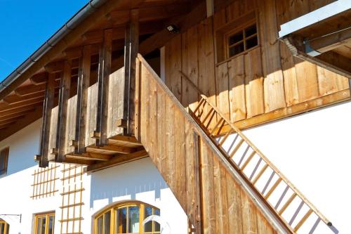 a wooden staircase on the side of a building at Ferienwohnung Bacher in Edling