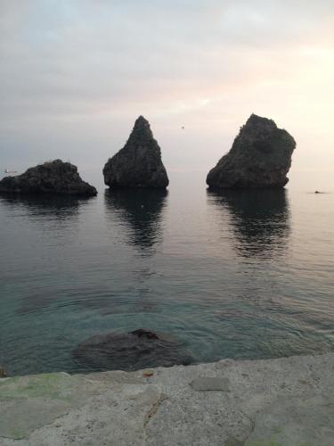a group of rocks in the water at CasaCri in Cava deʼ Tirreni