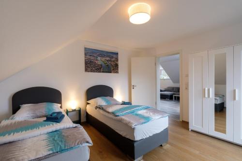 Ένα ή περισσότερα κρεβάτια σε δωμάτιο στο Townus Apartments Wiesbaden
