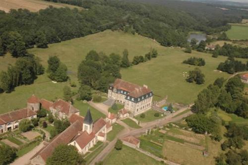an aerial view of a large house in a field at Château de Flée in Semur-en-Auxois