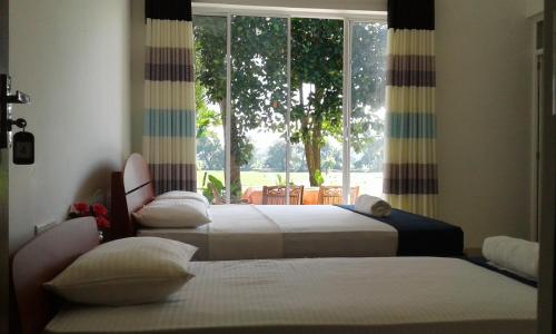 Säng eller sängar i ett rum på Risenlak Holiday Resort