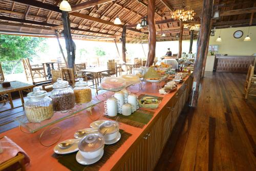 a long table with food on it in a restaurant at Railay Great View Resort in Railay Beach