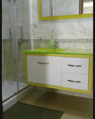 a bathroom with a sink and a shower at Sweet Home in Falerna