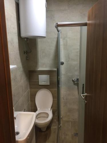 Koupelna v ubytování Grand Casa Apartments