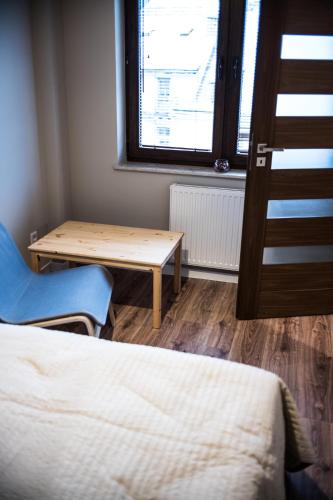 Ένα ή περισσότερα κρεβάτια σε δωμάτιο στο Apartamenty Opal