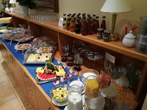 a buffet with many plates of food and drinks at Haus Seeblick Hotel Garni & Ferienwohnungen in Zinnowitz