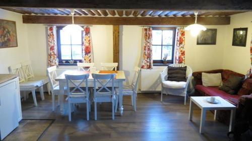 a living room with a table and chairs at chalupa Krkonoše in Háje