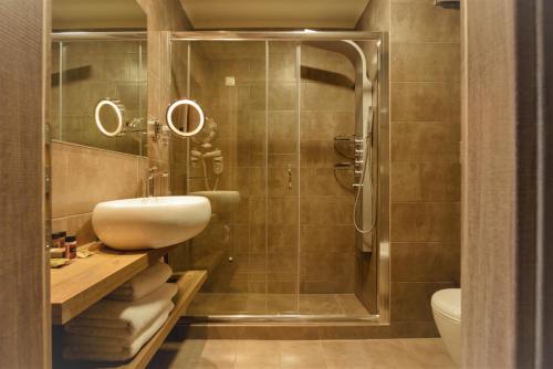 a bathroom with a sink and a shower at Congo Palace in Athens