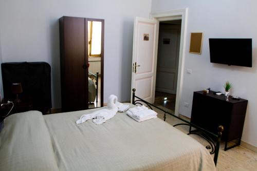 Кровать или кровати в номере I Sorrisi Di Napoli