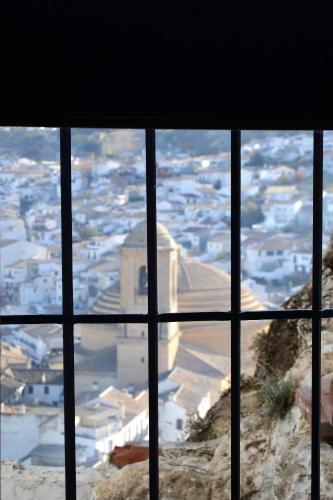 a view of a city from a window at Casa del Arrabal in Montefrío