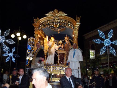 a group of men standing in front of a religious altar at Dolce nido in Pedara