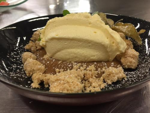 a plate of food with a piece of ice cream at Hotel Locanda Da Carla in Vigevano