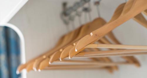 a close up of wooden spoons on a rack at Hotel Hawaii Bed and Coffee in Riccione