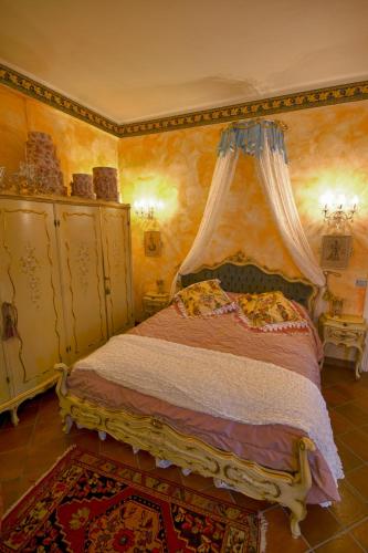 Postel nebo postele na pokoji v ubytování B&B La Maison degli Angeli