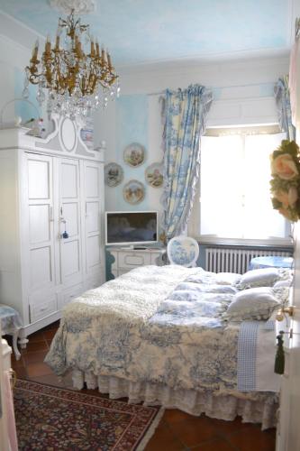 Postel nebo postele na pokoji v ubytování B&B La Maison degli Angeli