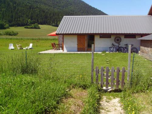 a small house with a fence in front of it at Gite Waykiu in Autrans