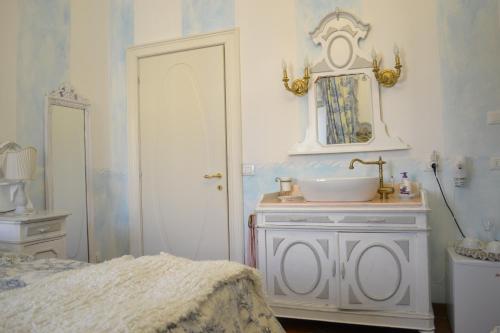 Postel nebo postele na pokoji v ubytování B&B La Maison degli Angeli