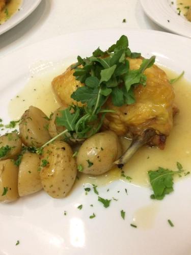 a white plate of food with potatoes and meat at Excelaris Grand Resort Conventions & Spa in Tequesquitengo