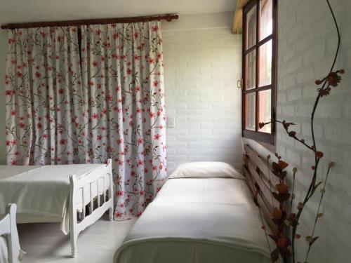 a hospital room with two beds and a window at Raco De La Calma in Nono