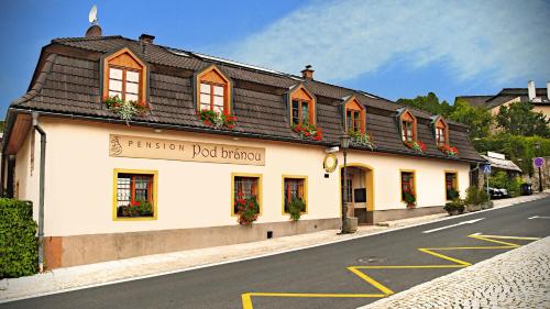 a building on the side of a street at Penzión Pod bránou in Poprad