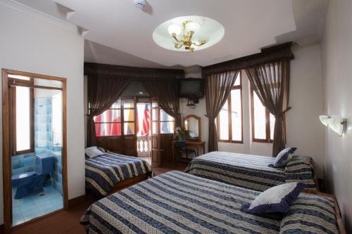 Postel nebo postele na pokoji v ubytování Hotel Plaza del Teatro