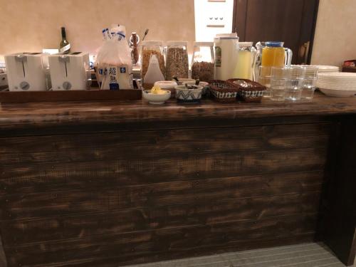 a wooden counter with food and drinks on it at Umitoyama Hakuba in Hakuba