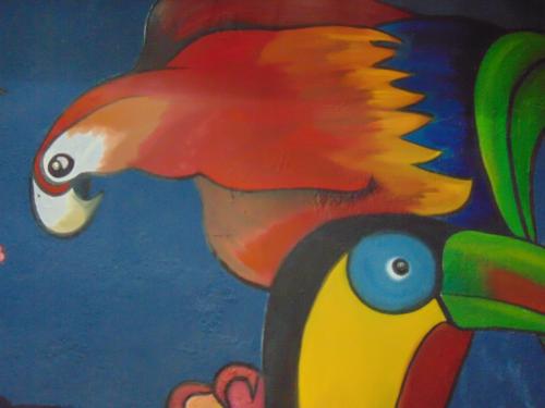 a painting of a colorful fish on a wall at Casa Lima B&B in San José