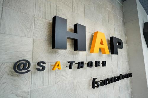 a sign for an art museum on a wall at Hap@sathorn in Bangkok