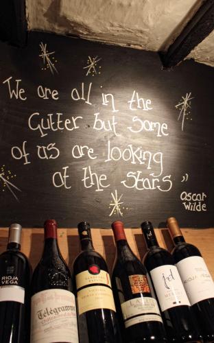 a chalkboard with a bunch of bottles of wine at Mason's Arms in Bowland Bridge