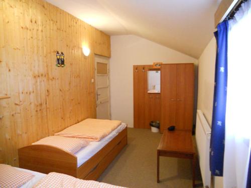 Postel nebo postele na pokoji v ubytování Horska chata Kristynka