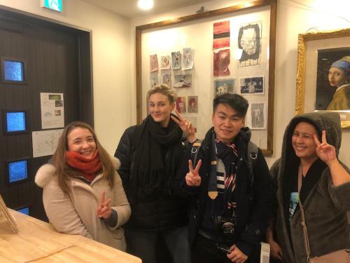 a group of people giving the thumbs up sign at Tokyo Art House in Tokyo