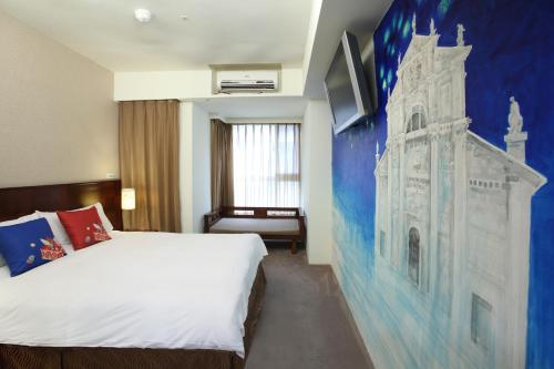 Katil atau katil-katil dalam bilik di In One City Inn