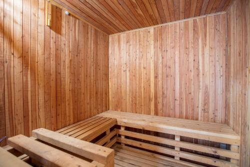 a wooden sauna with a wooden bench in it at Motel Bor in Vitez