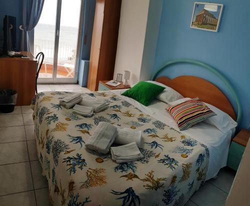 Кровать или кровати в номере Hotel Ristorante La Scogliera - NUOVA GESTIONE