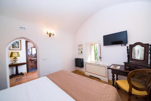 Säng eller sängar i ett rum på Badia Santa Maria de' Olearia